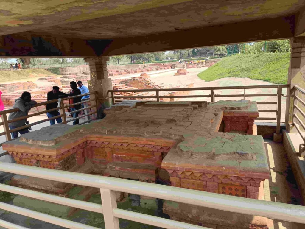 Ancient ruins under protective structure.